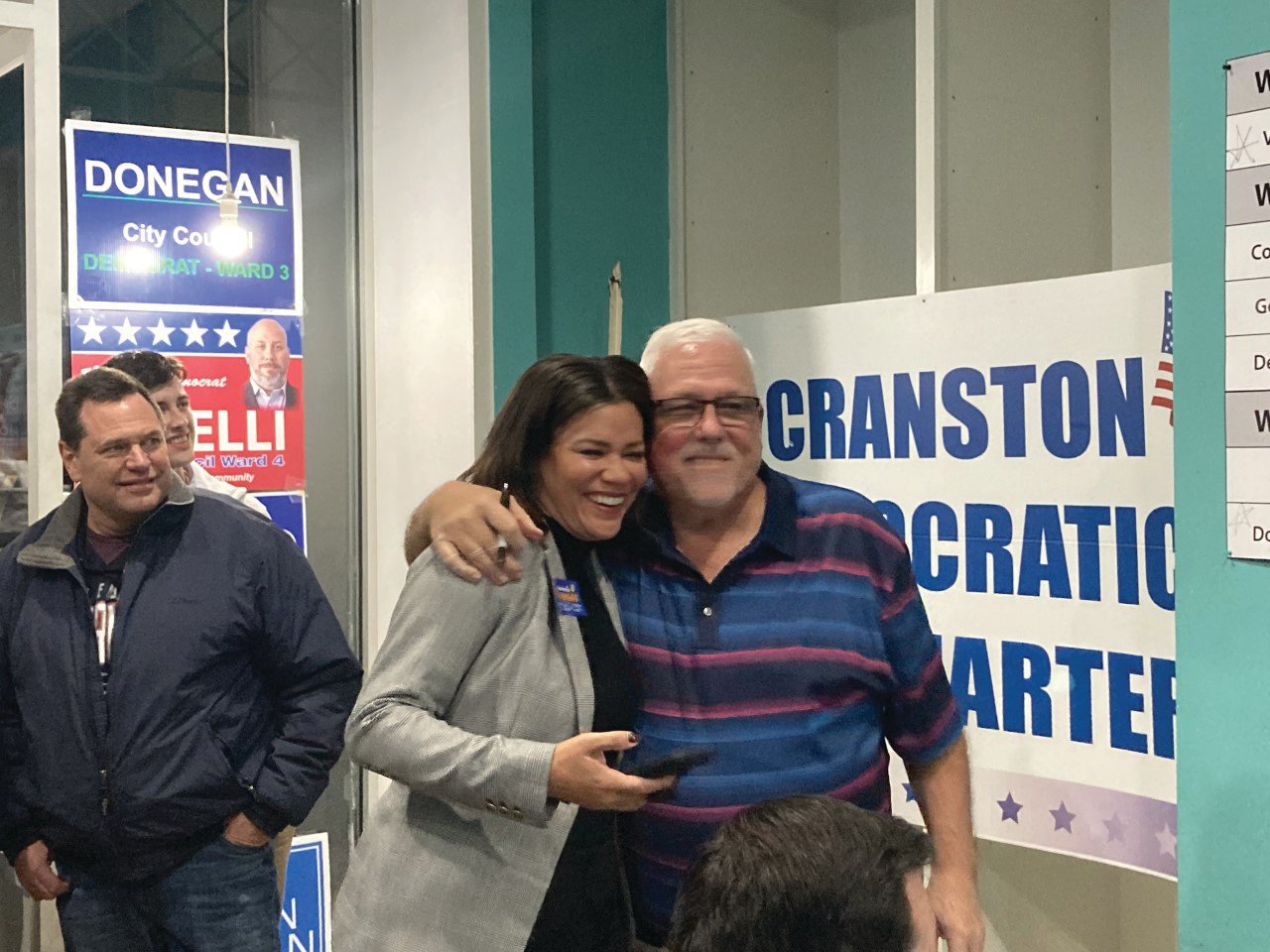 HUGS: Ward 1 council candidate Lammis Vargas receives a hug from Richard Santa Maria for winning the Ward 1 seat. (Herald photo)